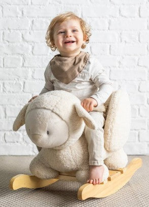 Child on nattou rocking sheep toy