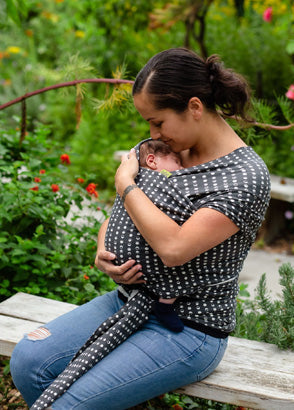 Mum carrying newborn in a Boba