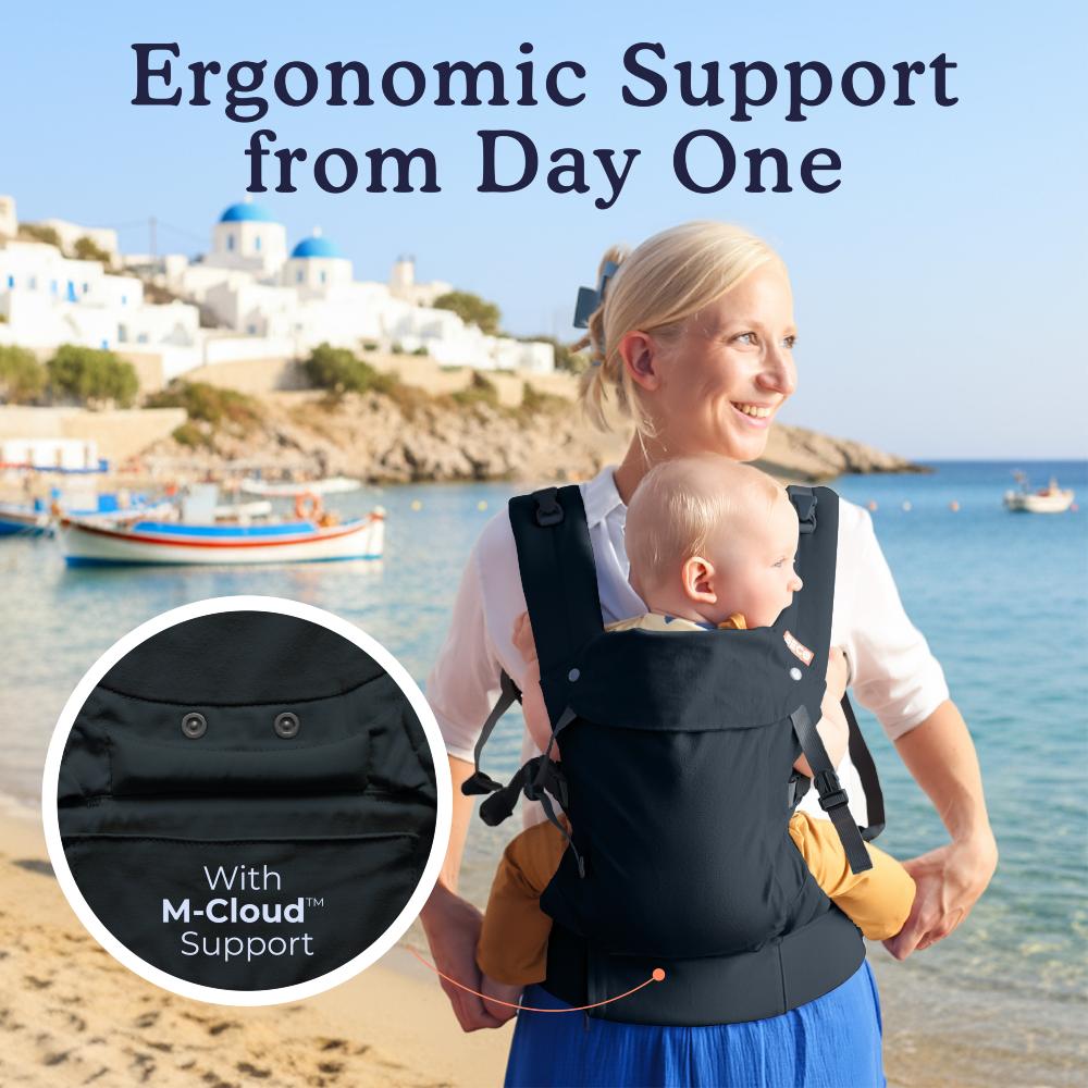 Beco Baby Carrier dark grey worn at the ebach with baby facing inwards