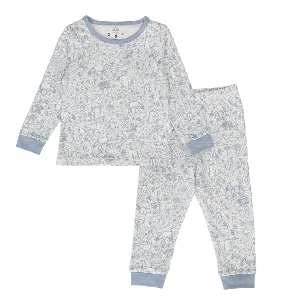 Child in cotton blue woodland print pyjamas on a white background