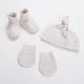Set of Merino Booties, Beanies and Mittens in Cream on a white background