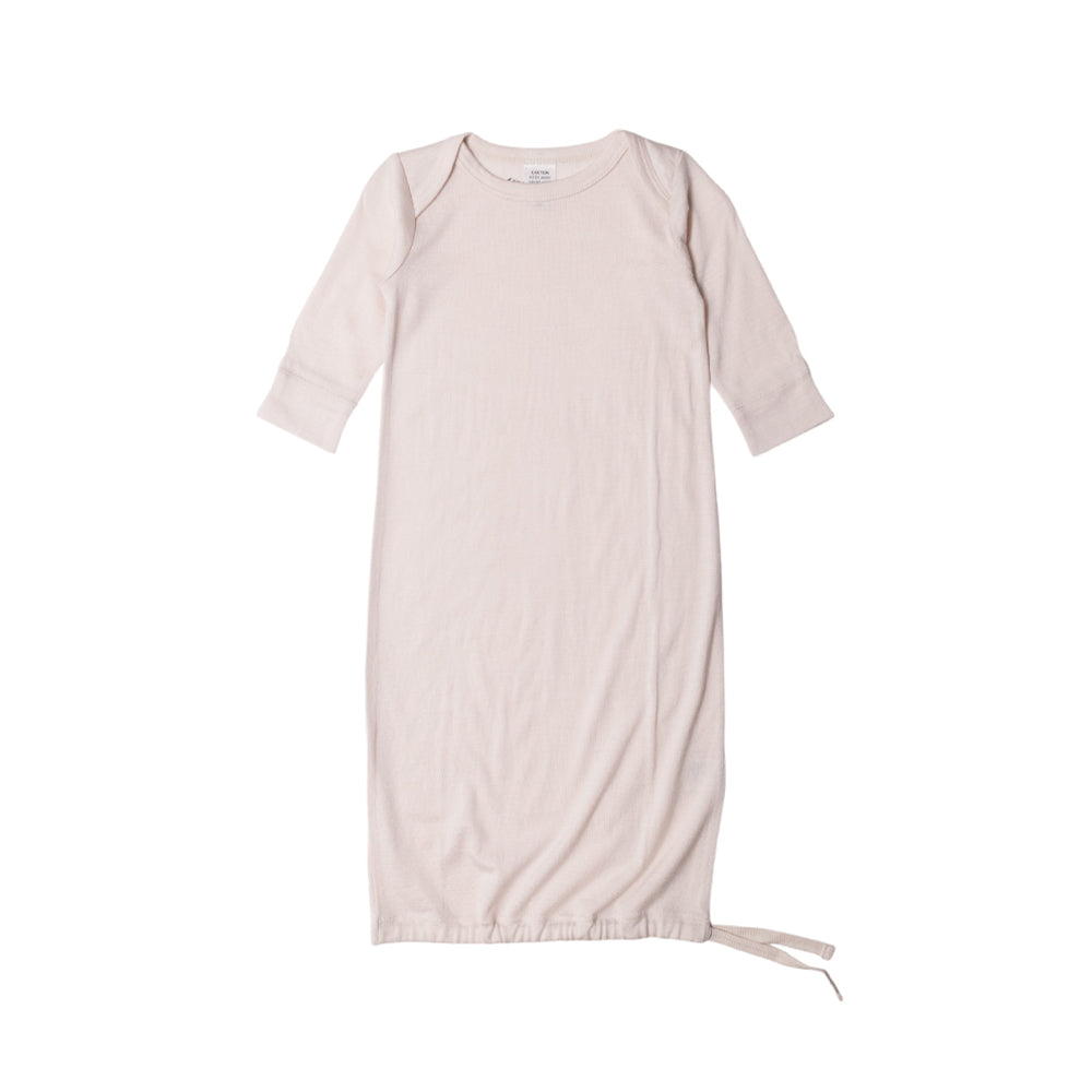 Cream baby merino gown on white background