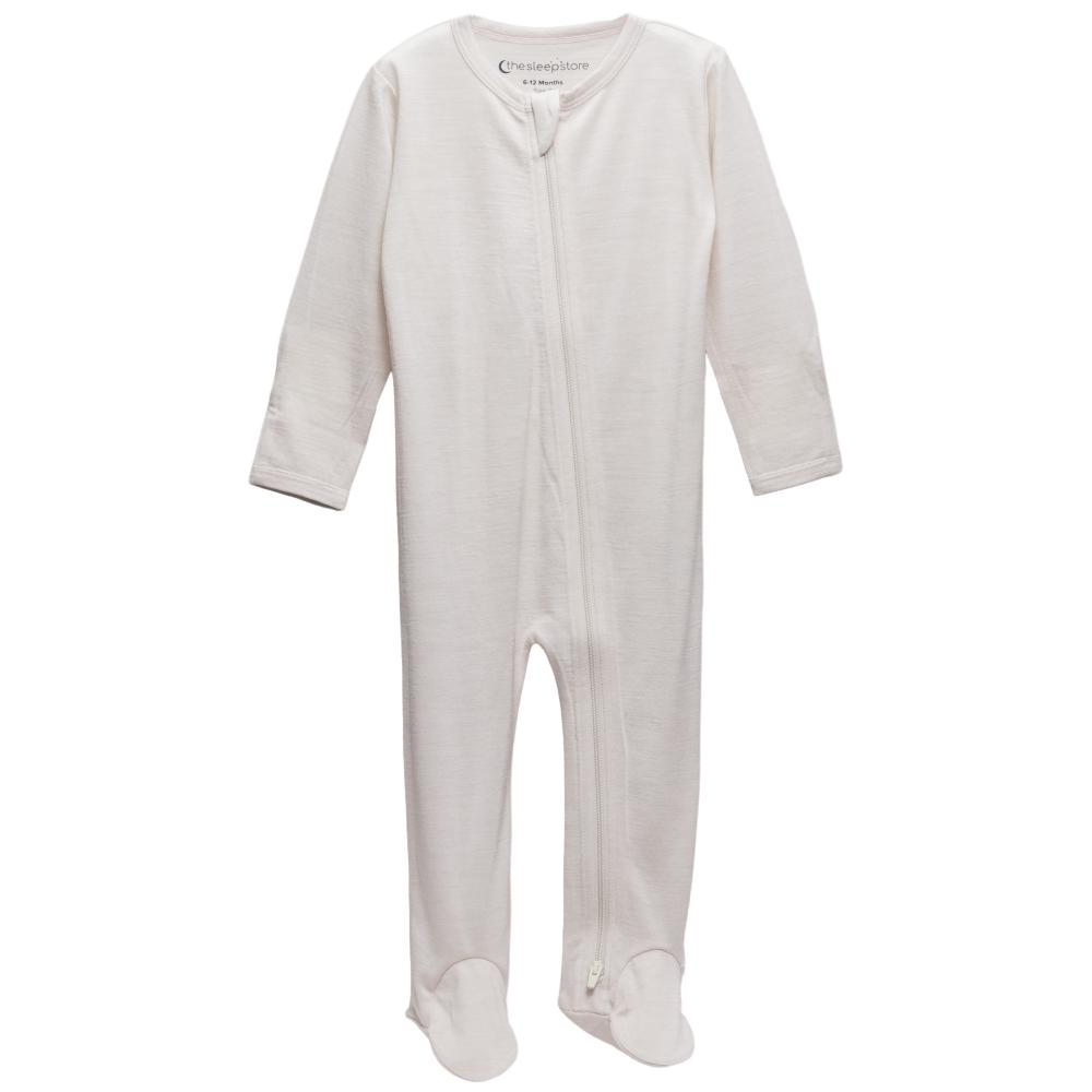 Cream footed merino zipsuit on a white background