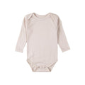 Cream merino long sleeve bodysuit on a white background