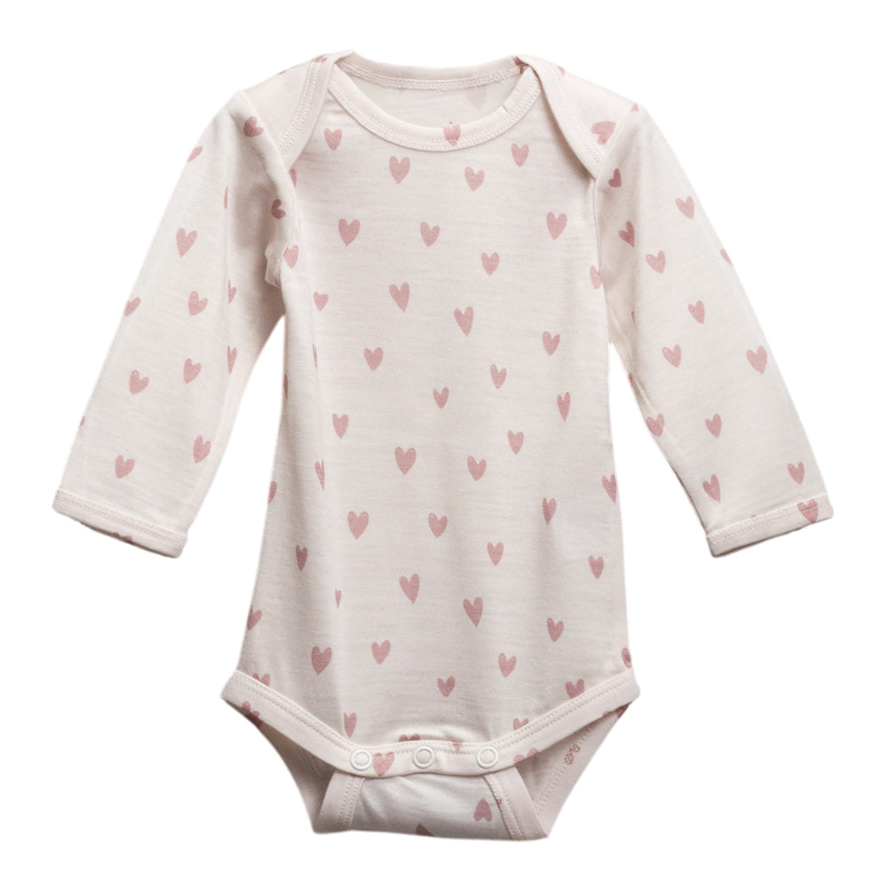 Cream with hearts print merino long sleeve bodysuit on a white background