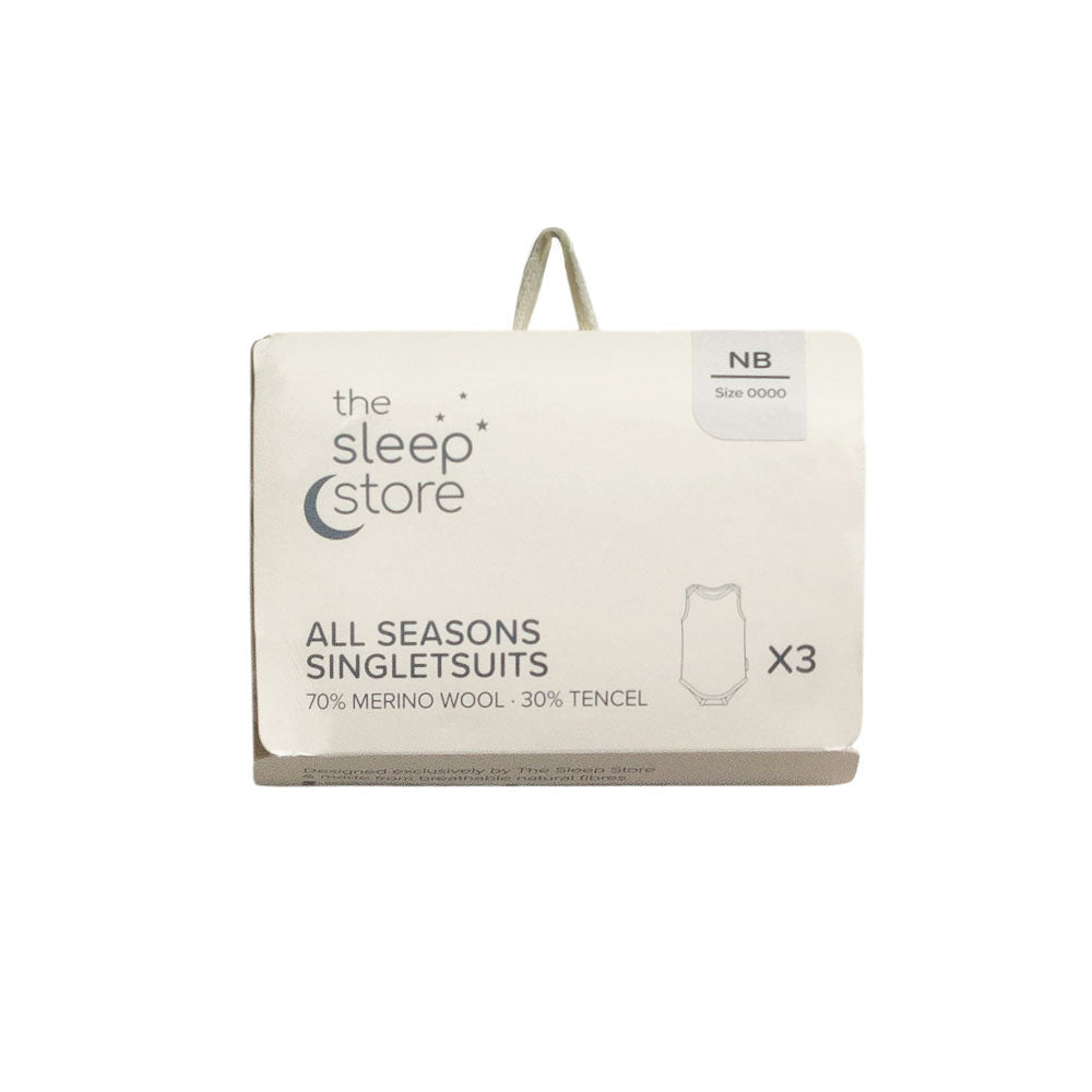 The Sleep Store All Seasons Singletsuits packaging box for size NB (0000), containing three single suits made of 70% merino wool and 30% tencel.