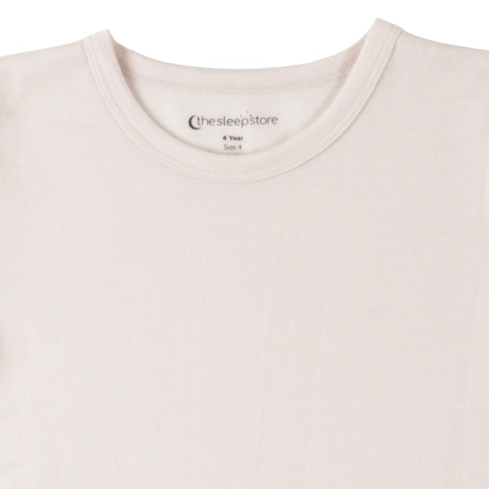 Close-up of a white crewneck t-shirt with the brand name 'thesleepstore' printed inside the collar.