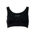 A black sleep bra with a crossover wrap front and wide shoulder straps, shown flat on a white background. The brand name The Sleep Store is printed inside the neckline.
