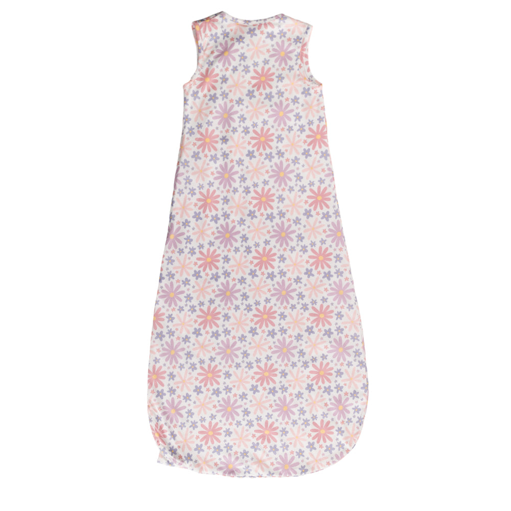 A sleeveless cotton baby sleep sack with a repeating floral starburst pattern in soft pink, peach, and lavender on a white background, shown flat against a white studio background.