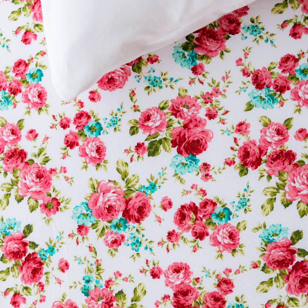 Pink Floral fitted sheet on white background