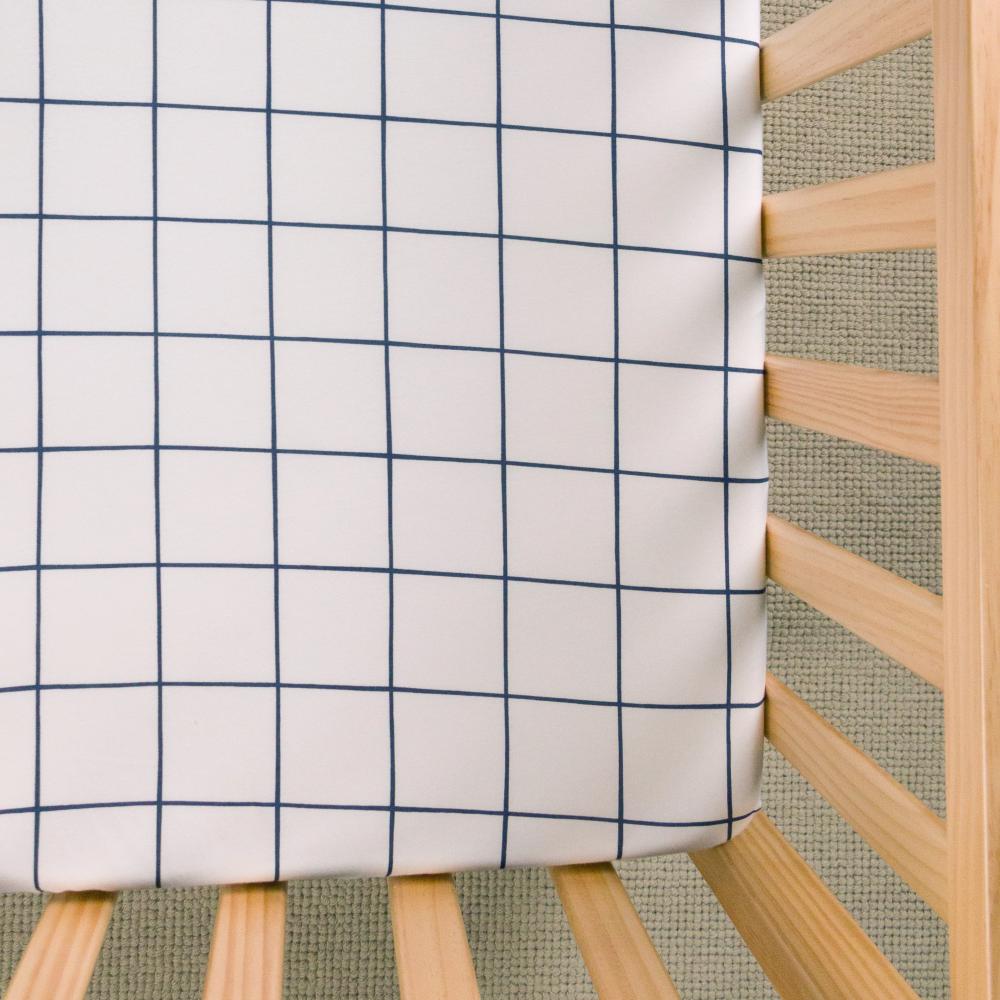 Navy Checker fitted sheet on white background