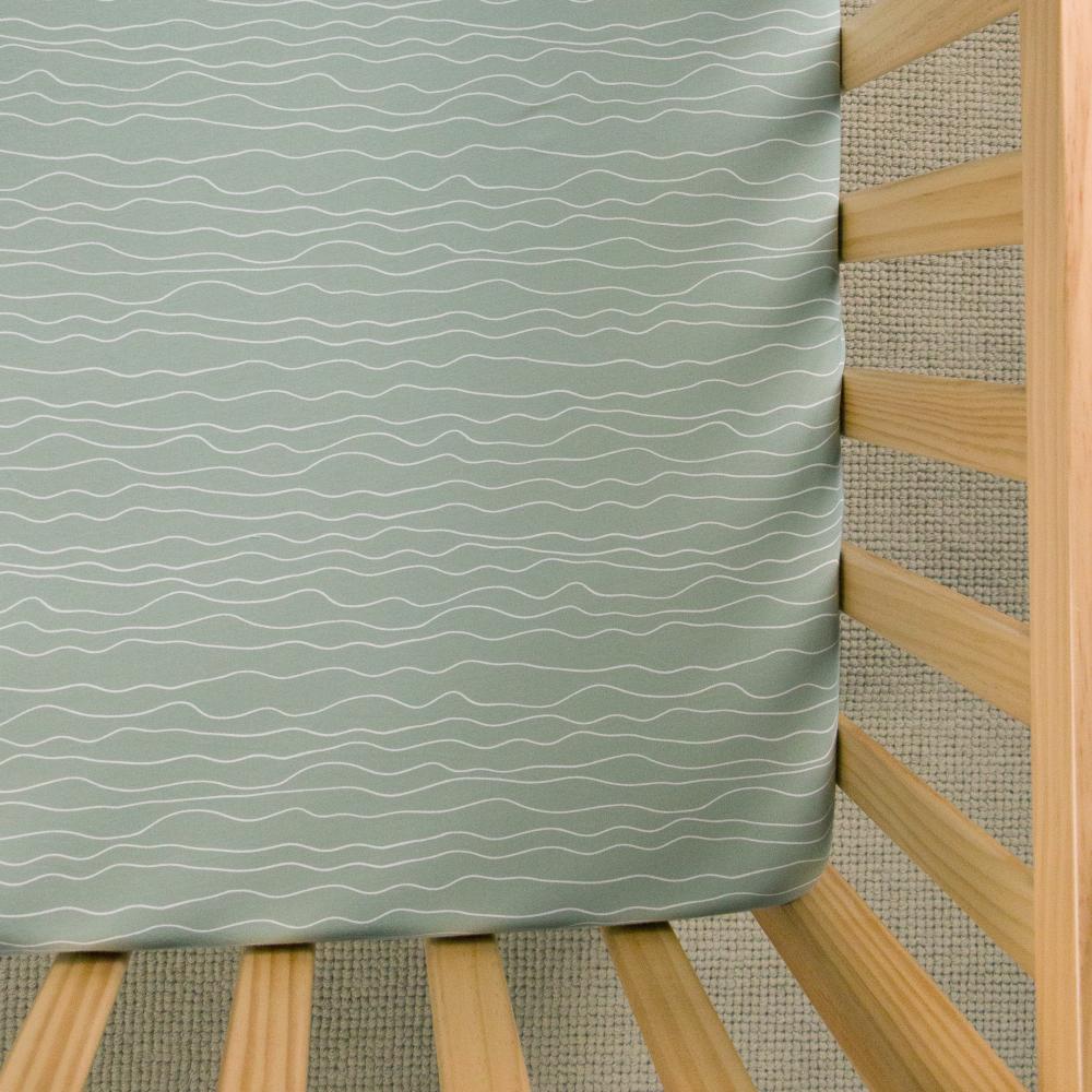 Green waves fitted sheet on white background