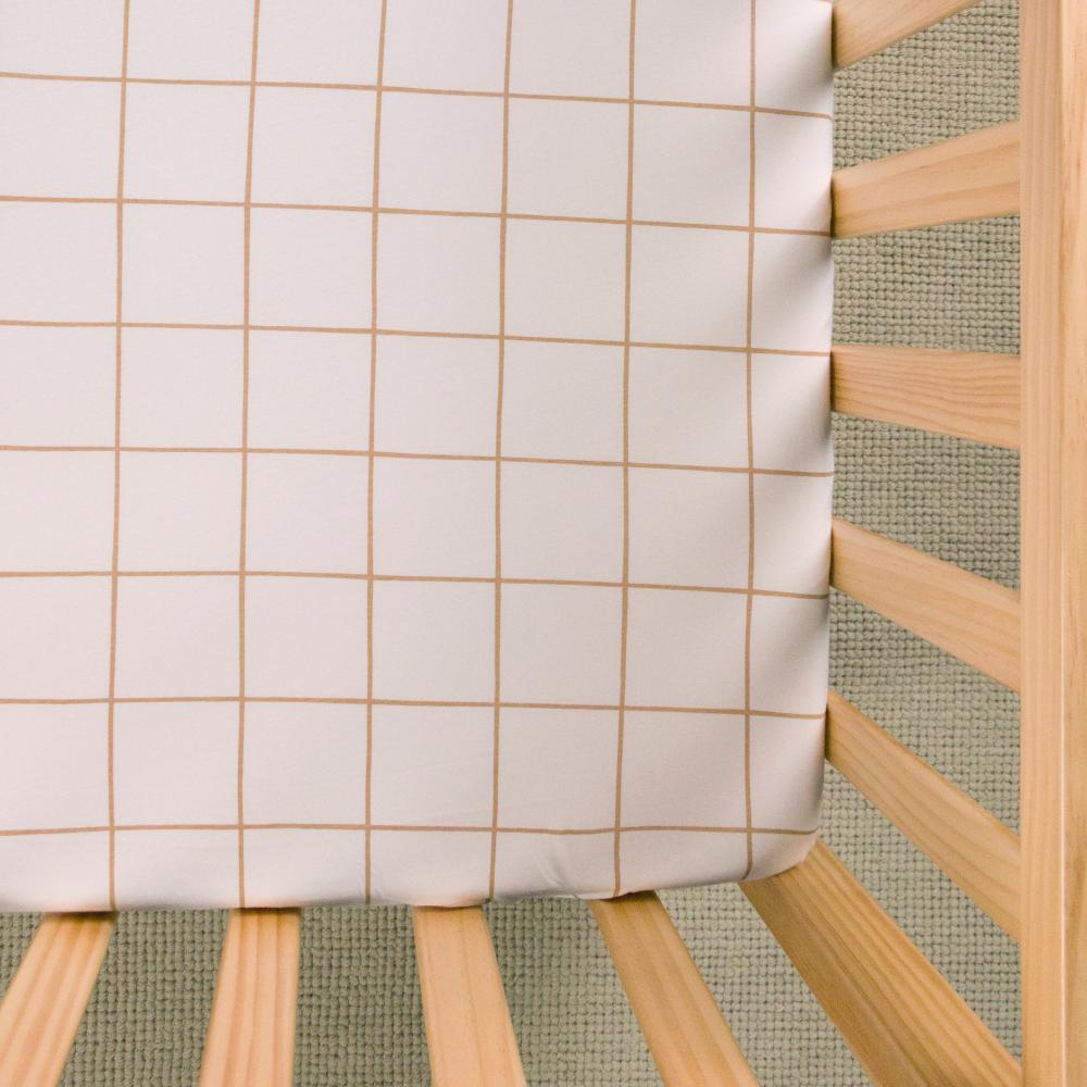 Tan Checker fitted sheet on white background