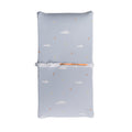 Blue baby changing mat with cloud and moon pattern on a white background