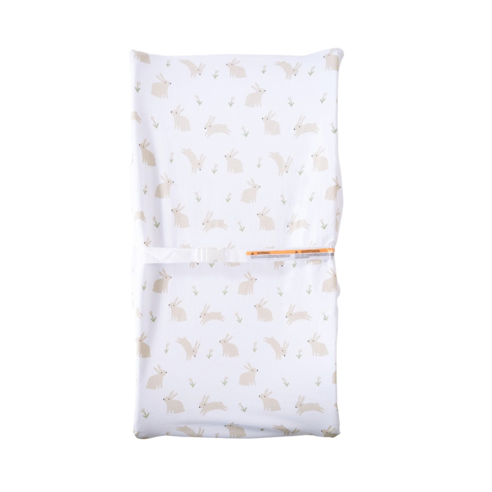 Change mat cover with cute bunny print on white surface on a white background