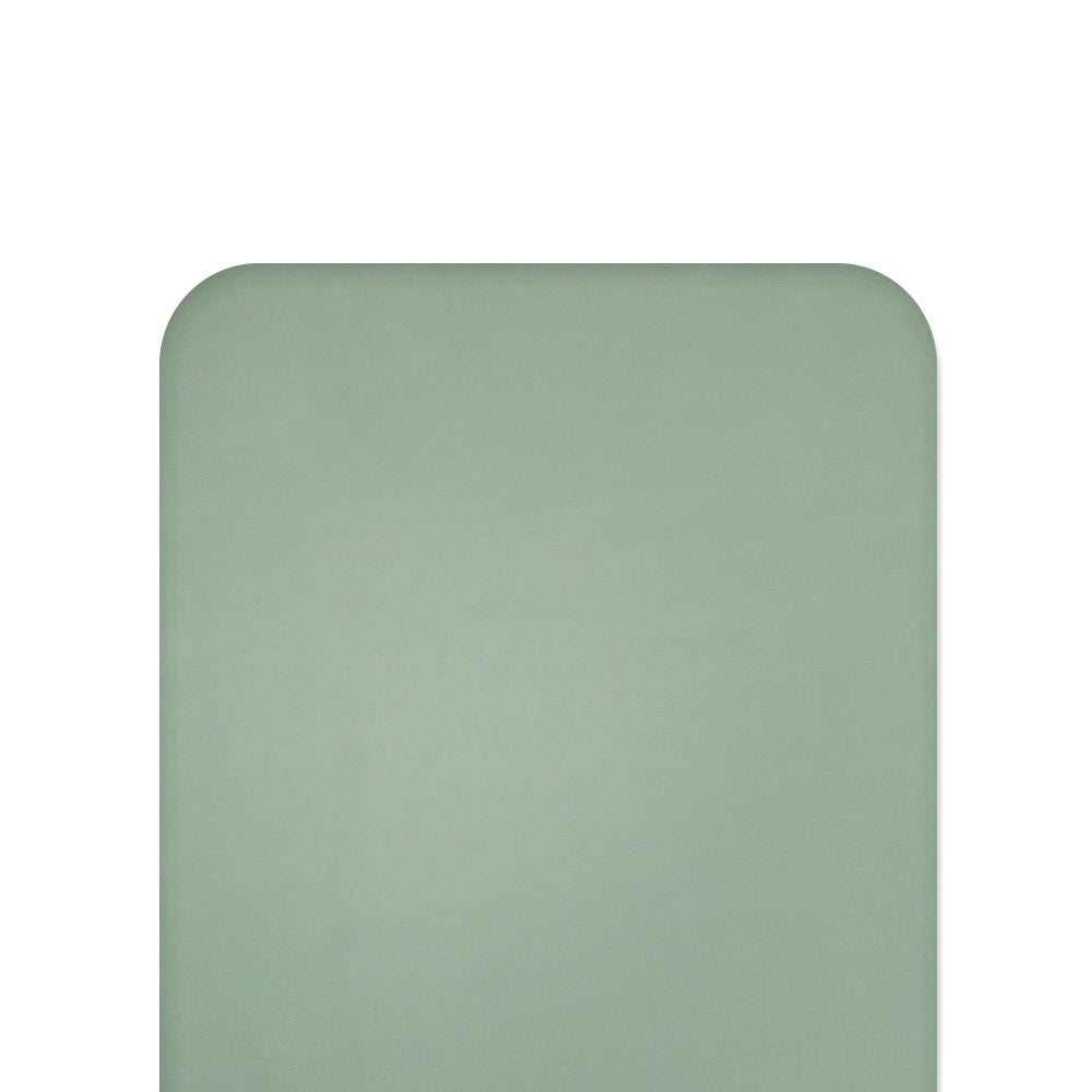 Green fitted sheet on white background
