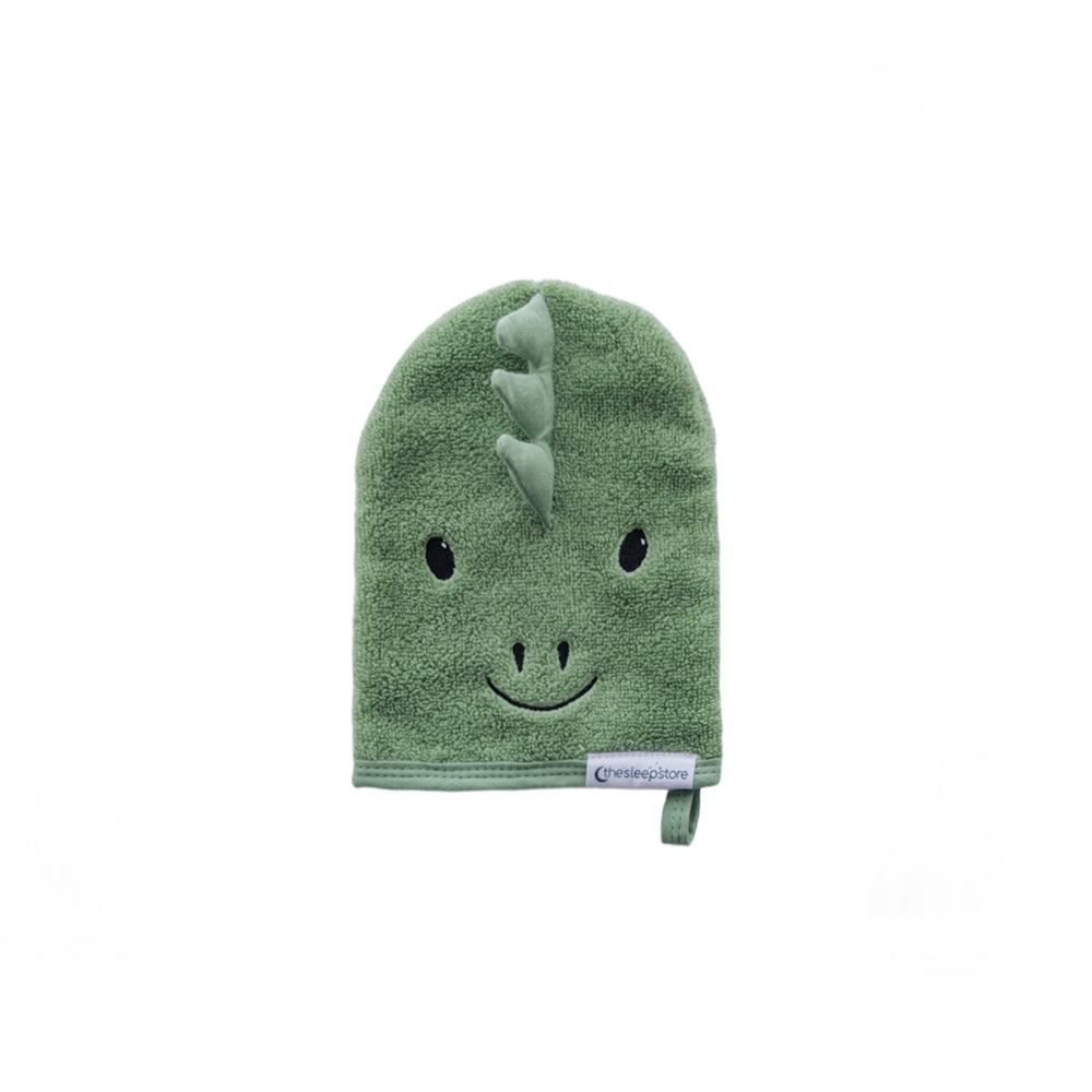 Green dinosaur-shaped bath mitt on a white background