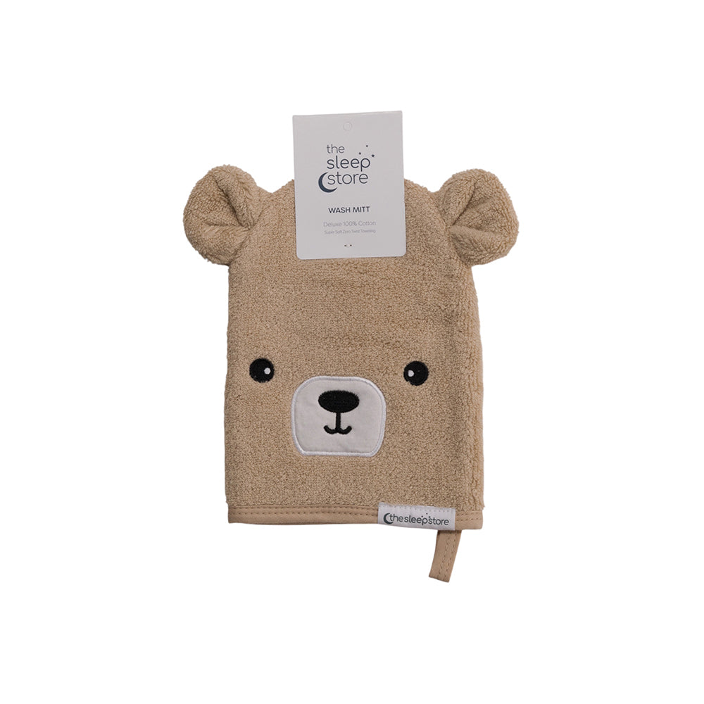 Bear-shaped wash mitt with ears and a face on a white background, featuring the Sleep Store logo.