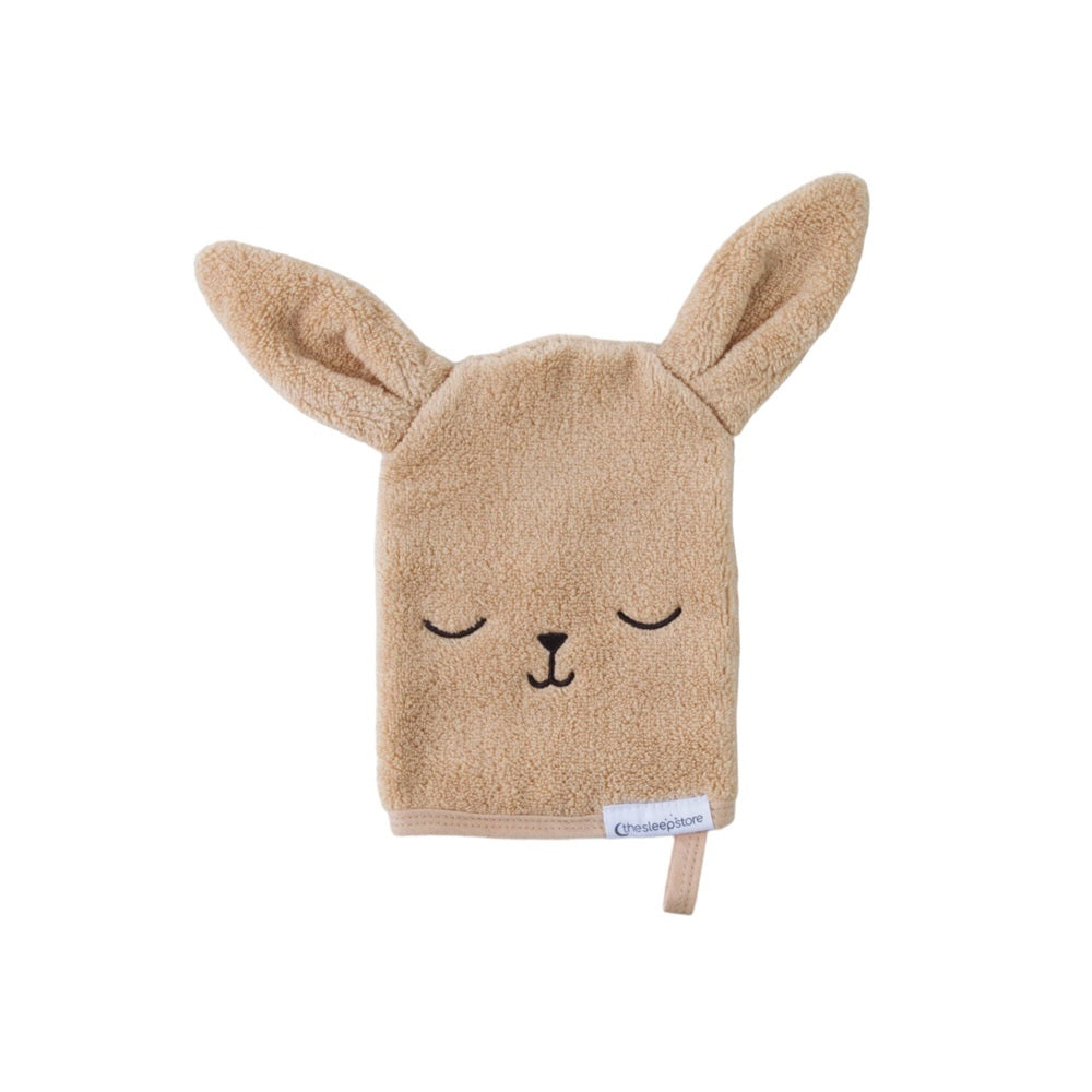 Beige wash mit with bunny ears and face on a white background