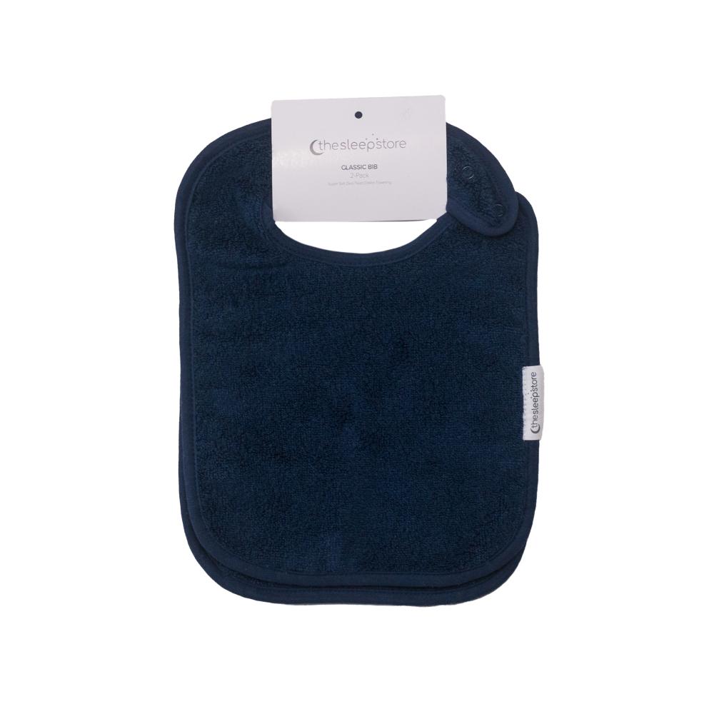 Navy blue cotton terry towelling classic bib with a Sleep Store brand tag on a white background