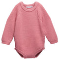 Pink knitted merino wool baby romper with longsleeves on a white background