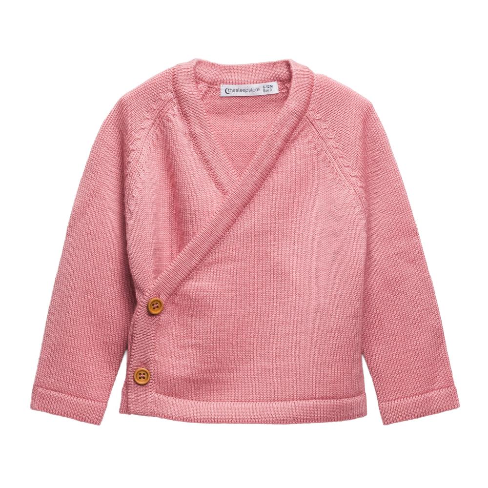 Pink merino wool baby kimono cardigan with brown buttons on a white background