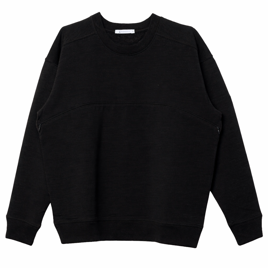A black merino fleece and tencel crewneck nursing sweatshirt with long sleeves and ribbed cuffs and hem, laid flat against a white background.