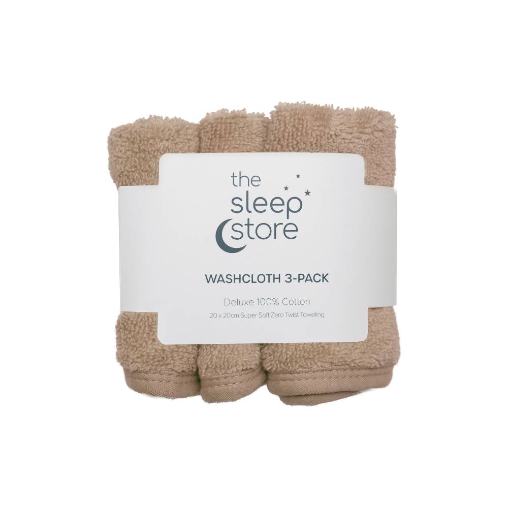 Three beige washcloths wrapped together with a label from 'the sleep store' on a white background.