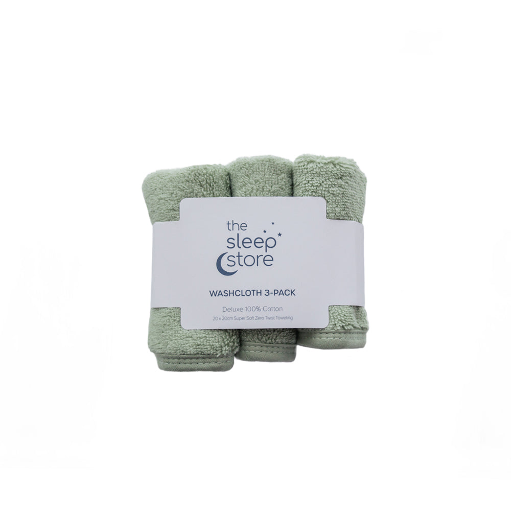 Three green cotton terry washcloths in a package with 'The Sleep Store' label on a white background