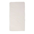 Natural fitted sheet on a mattress on a white background