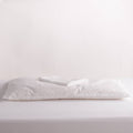 Wool pillow with pillowcase on top on white background
