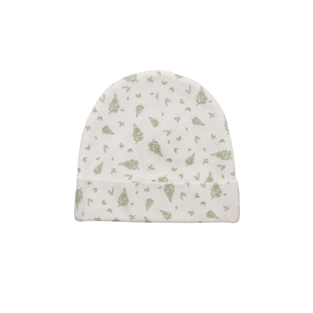 White baby hat with green leaf pattern on a white background