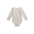 Baby cotton long sleeve onesie with green leaf pattern on a white background