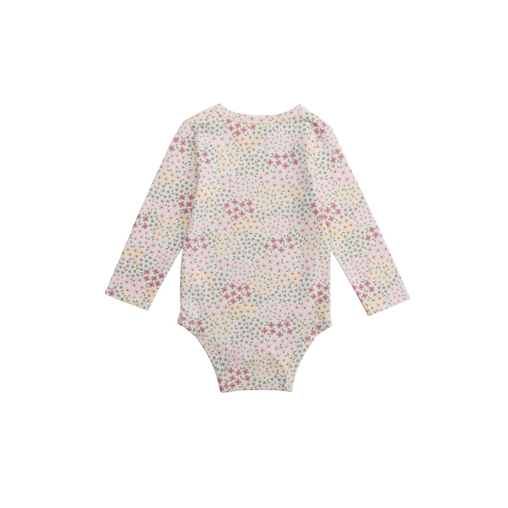 Floral patterned baby onesie on a white background