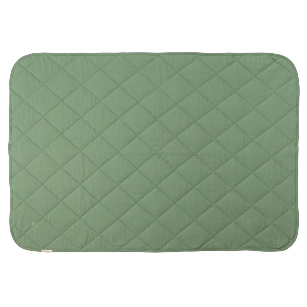A fern green colour quilted blanket on a white background. 