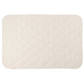 A natural cream colour quilted blanket on a white background. 
