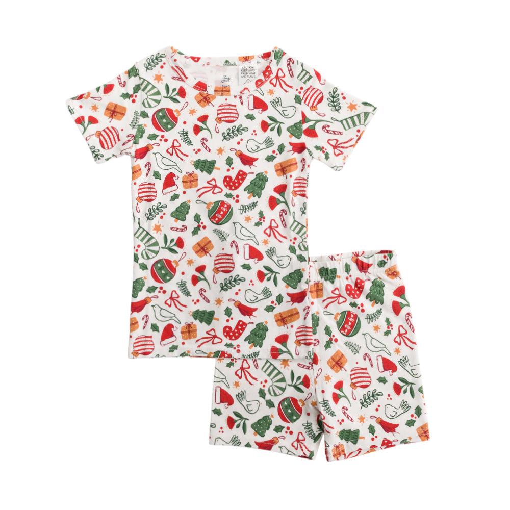 Children's pajama set with Christmas-themed pattern on a white background
