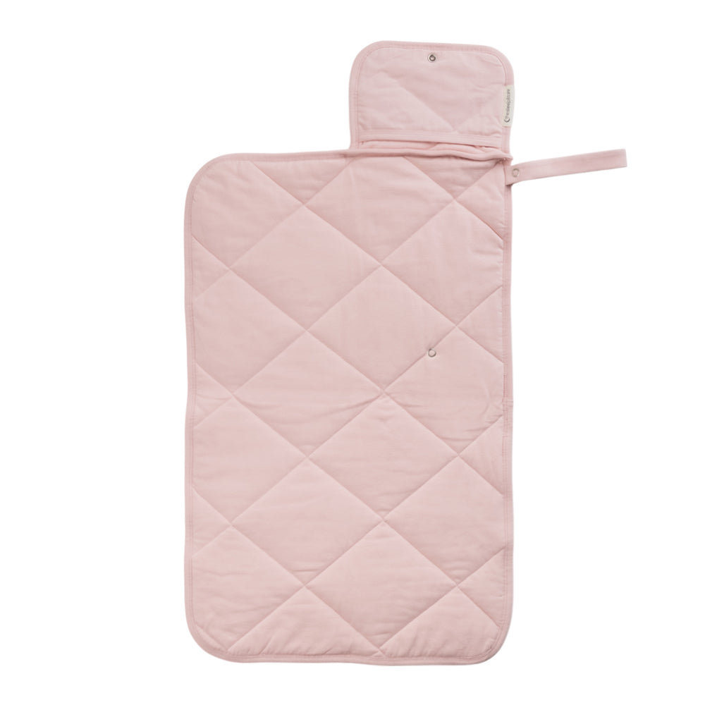A Blush Pink quilted change mat opened out flat on a white background. 