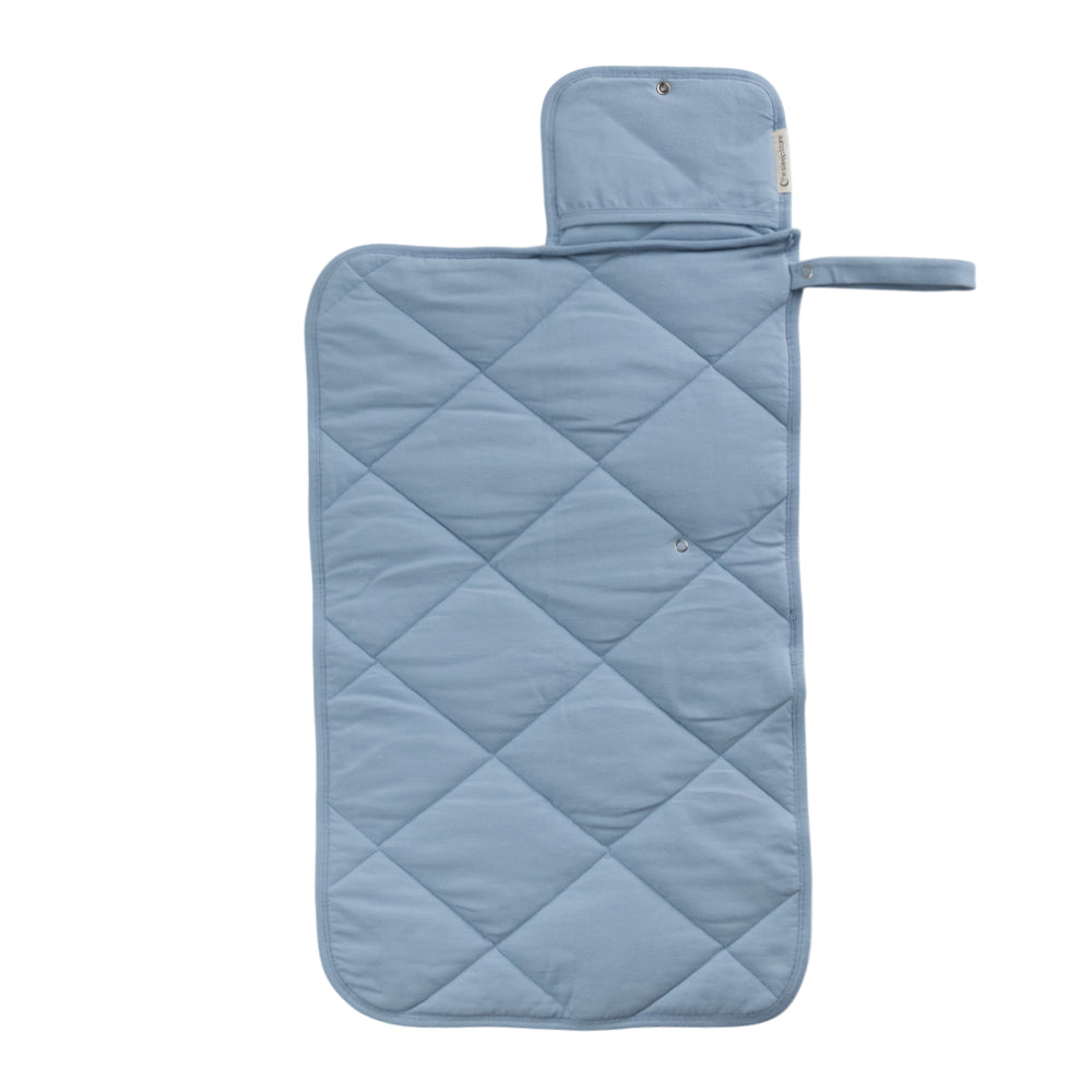 A Light Blue quilted change mat opened out flat on a white background. 