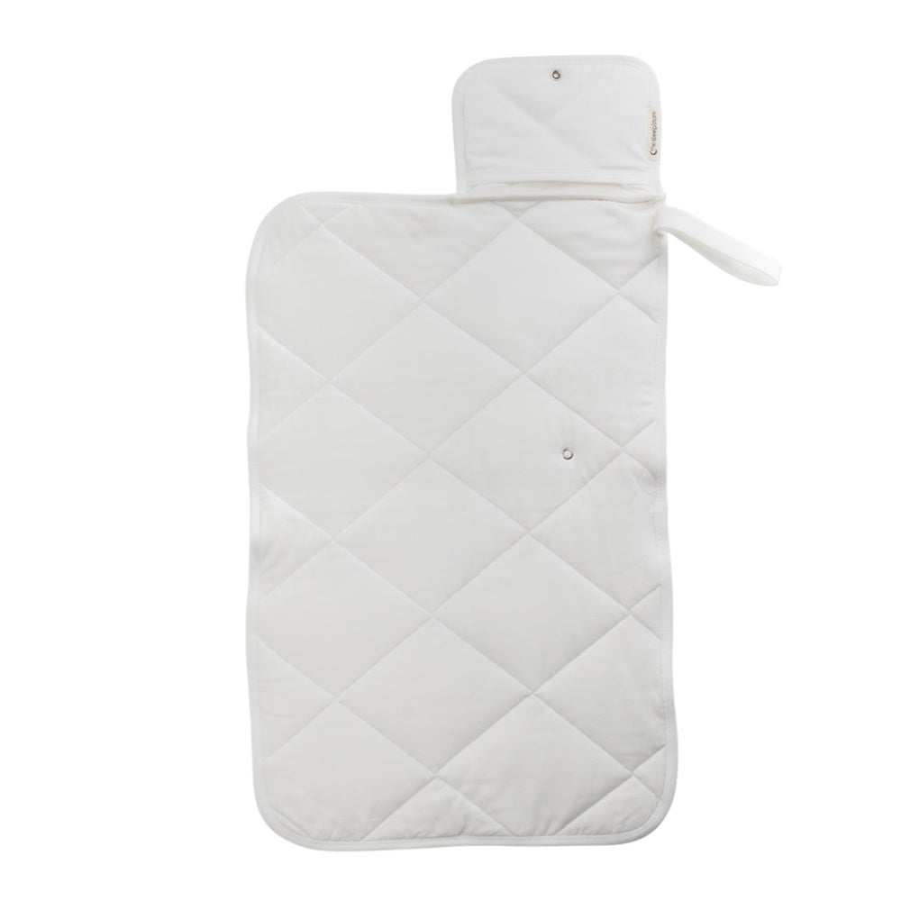 A Natural Cream quilted change mat opened out flat on a white background. 