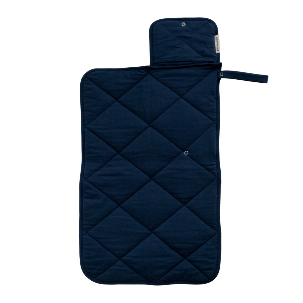 A Navy Blue quilted change mat opened out flat on a white background. 