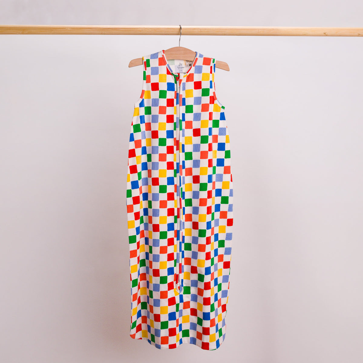 Hanging shot of a baby sleeping bag in the check print. 