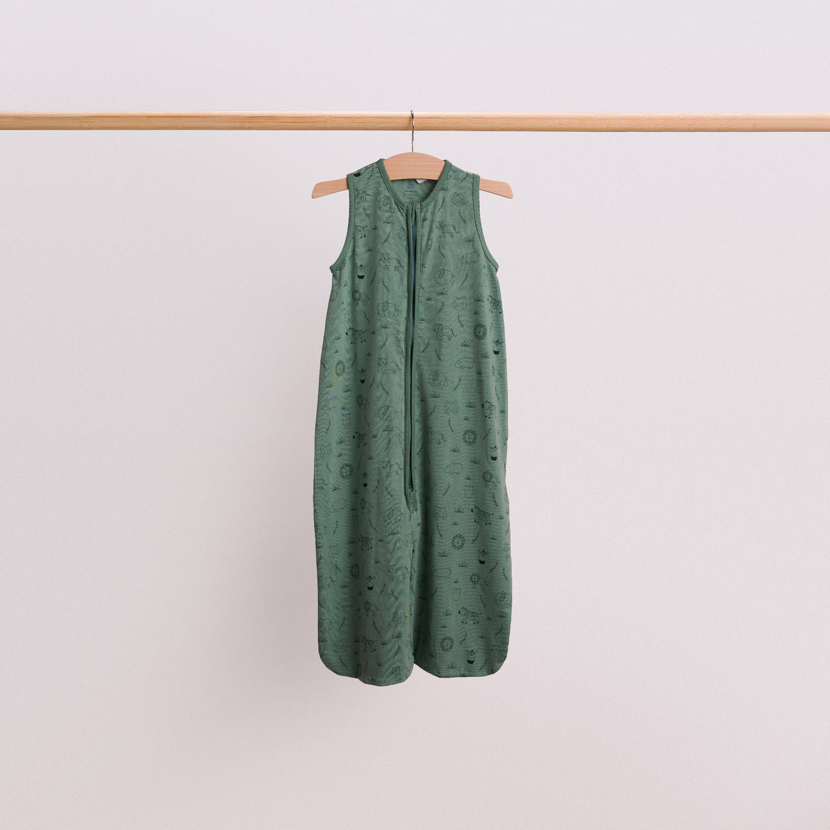 Hanging shot of a baby sleeping bag in the Fern Safari print. 