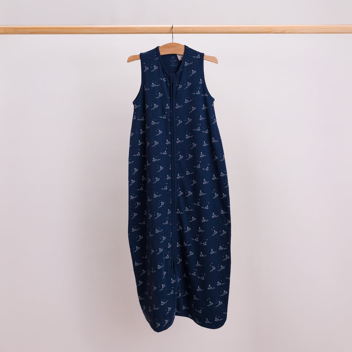 Hanging shot of a baby sleeping bag in the Sailboat print. 