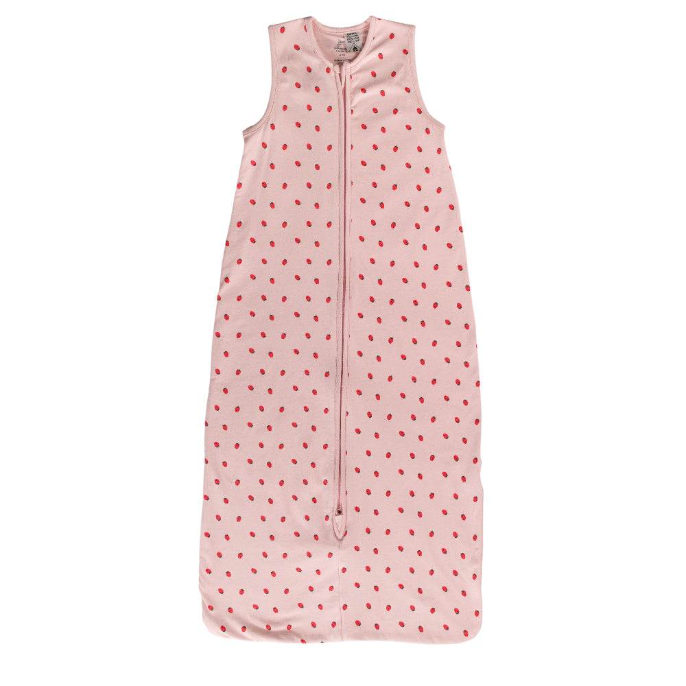 A pink sleeveless cotton baby sleep sack with a strawberries shown flat against a white background.