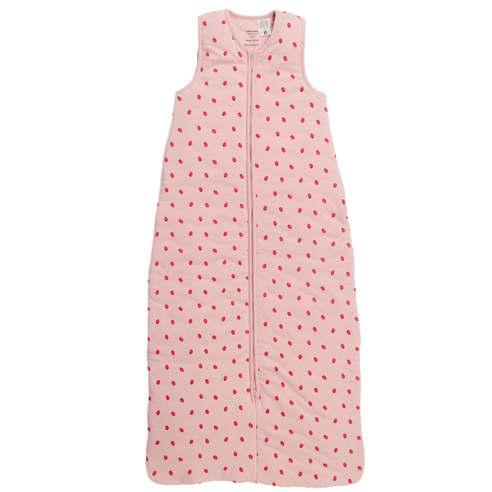 A pink sleeveless cotton baby sleep sack with a strawberries shown flat against a white background.