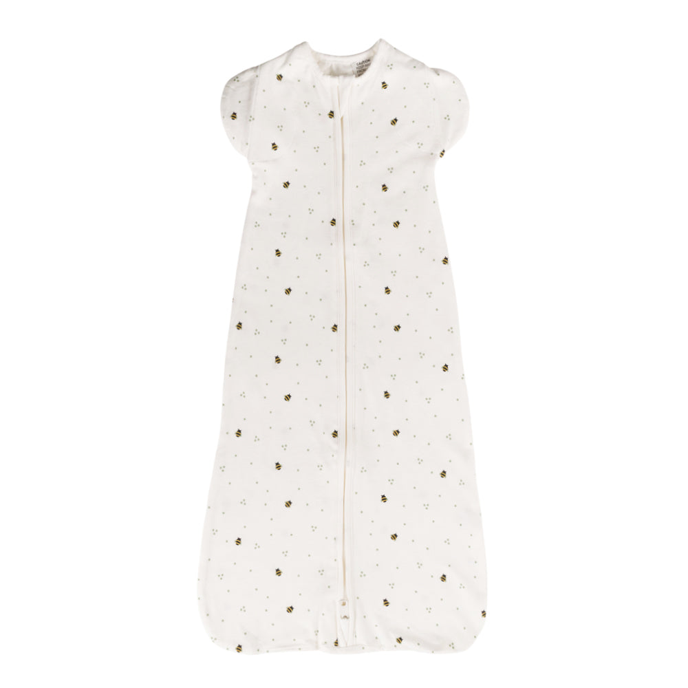 White organic cotton zip with gold polka dots on a white background