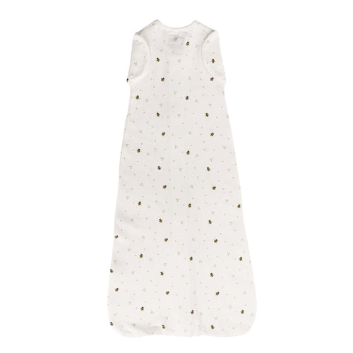 White cotton zip swaddle with bee print on a white background
