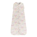 Floral patterned organic cotton baby sleeping bag on a white background