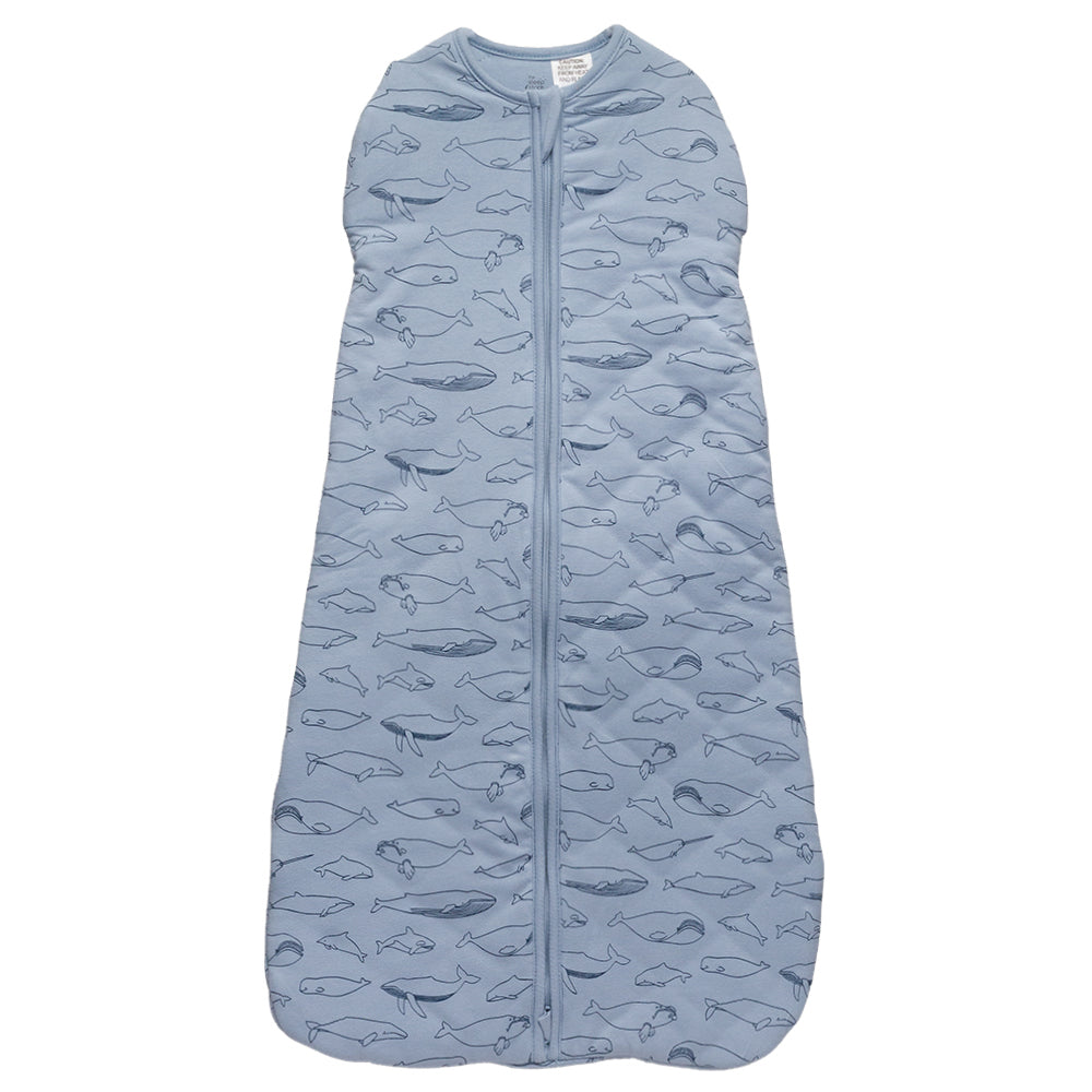 Blue baby sleeping bag with whale pattern on a white background